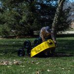 man dumping contents from a GCSD-8