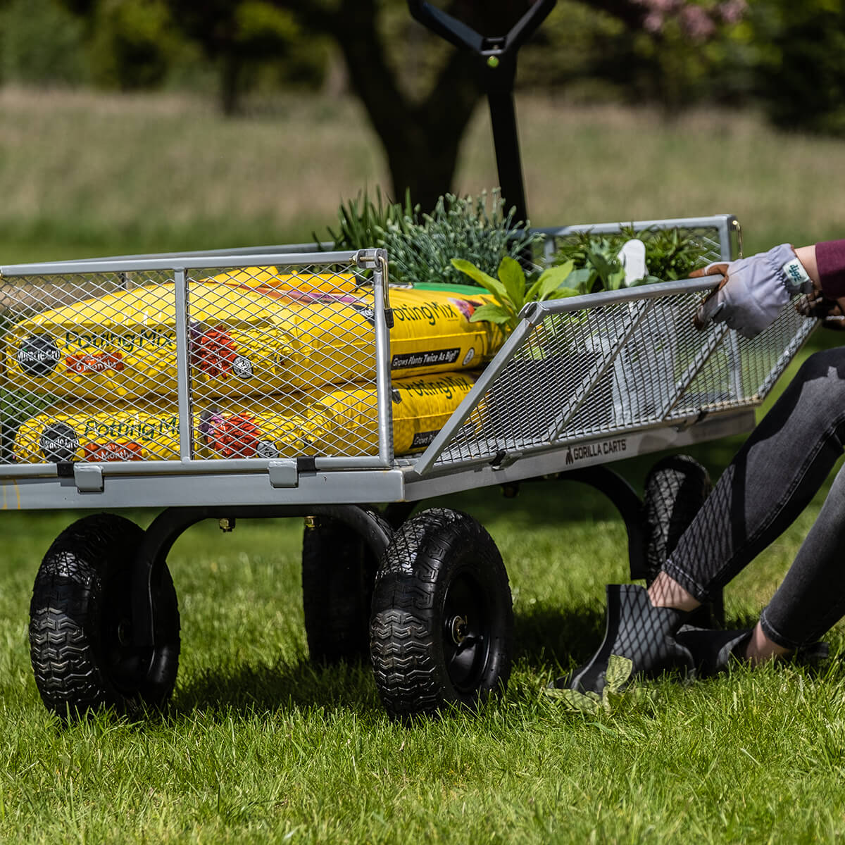 GOR-1201-2 filled with Gardening tools and bags of dirt